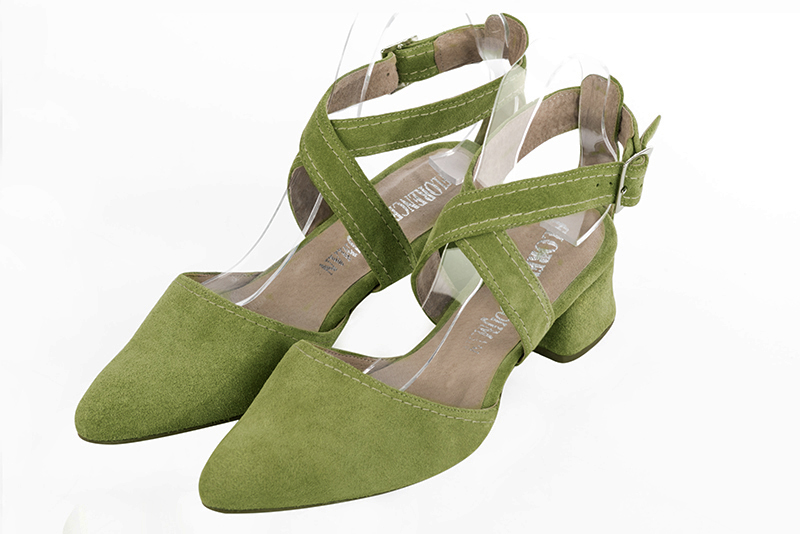 Pistachio green women's open back shoes, with crossed straps. Tapered toe. Low flare heels. Front view - Florence KOOIJMAN
